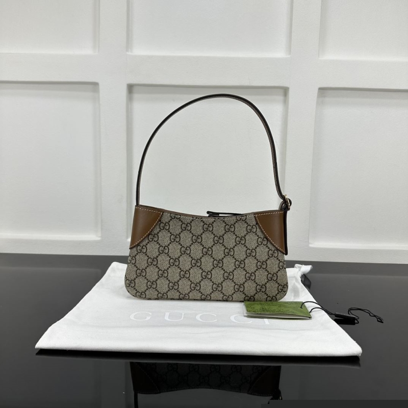 G*u*i top handle bags